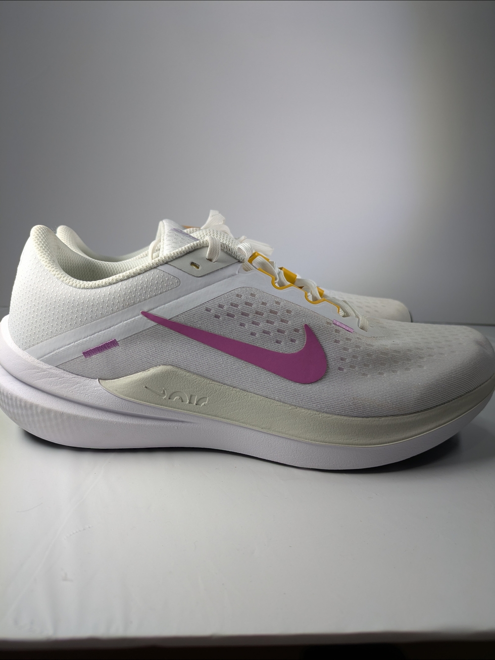 Nike Women's White Running Shoes with Pink Swoosh and Yellow Lace Accents